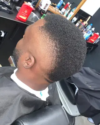 Afro fade shaped into a mohawk