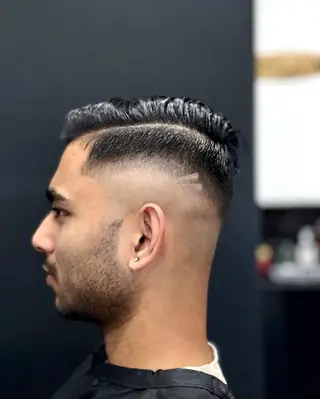 Hard side part with a skin fade