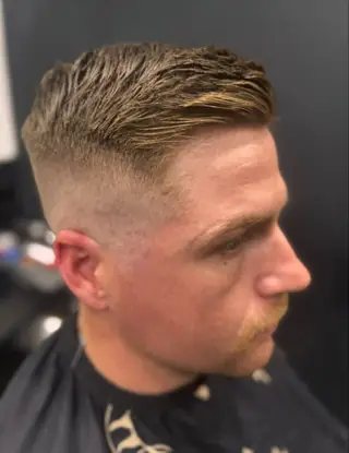 Skin fade with a textured quiff