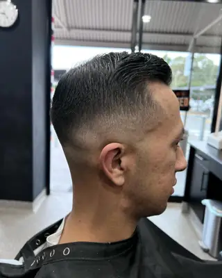 Zero fade with a slicked-back finish